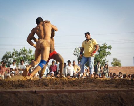 Kushti / Pehlwani mud wrestling: photograph by Lebd