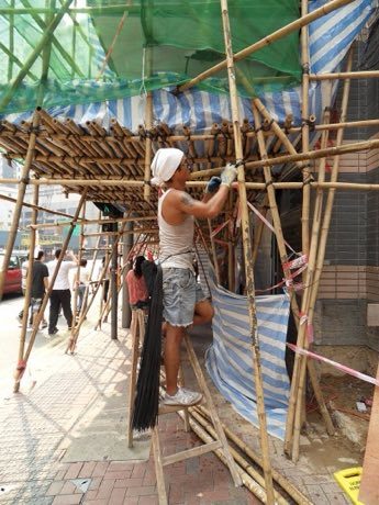Bamboo scaffold builder: photograph by Clément Bucco-Lechat